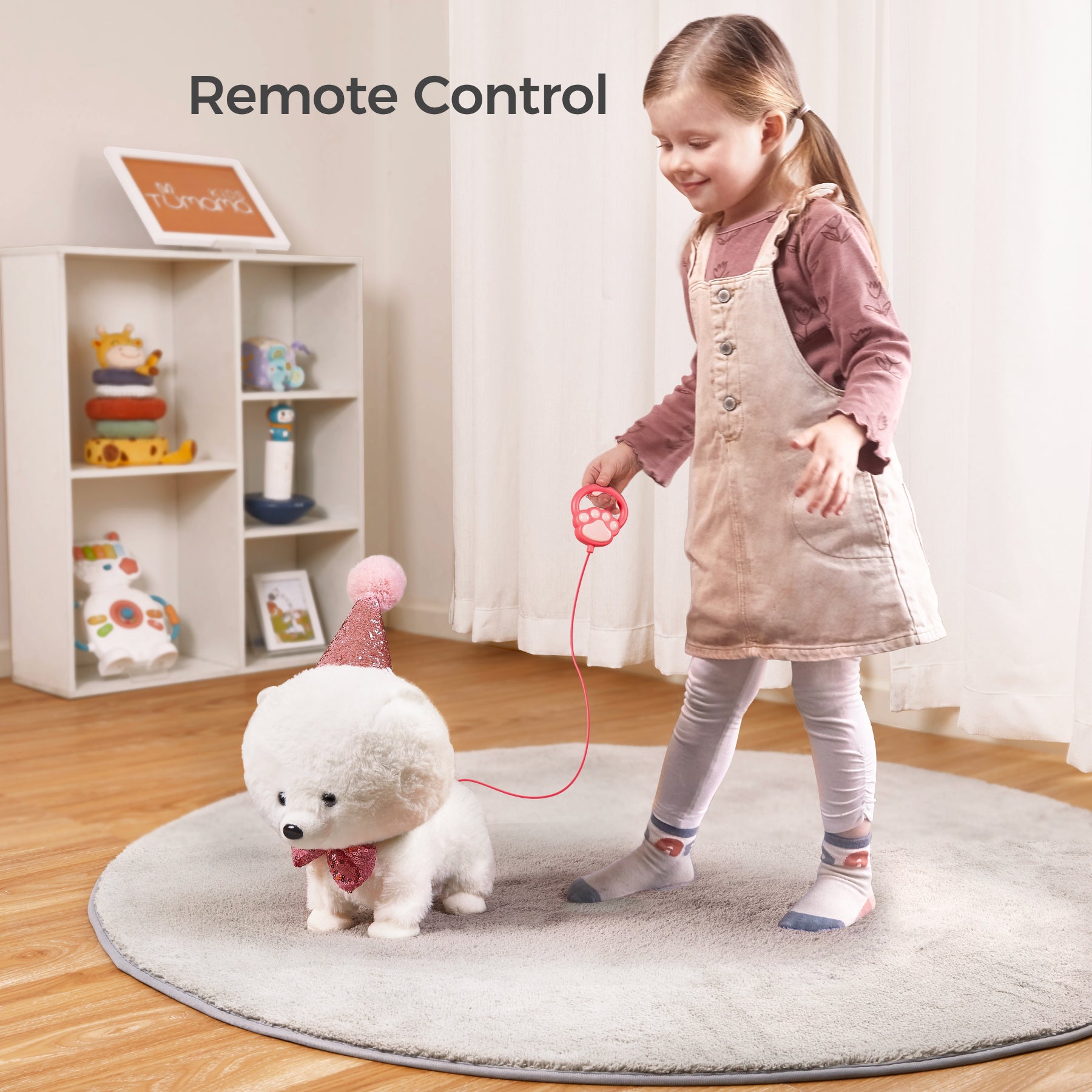 A young girl walking with a remote-controlled plush puppy wearing a party hat and bowtie. The puppy is being controlled by a paw-shaped remote, making for an engaging and interactive playtime experience.
