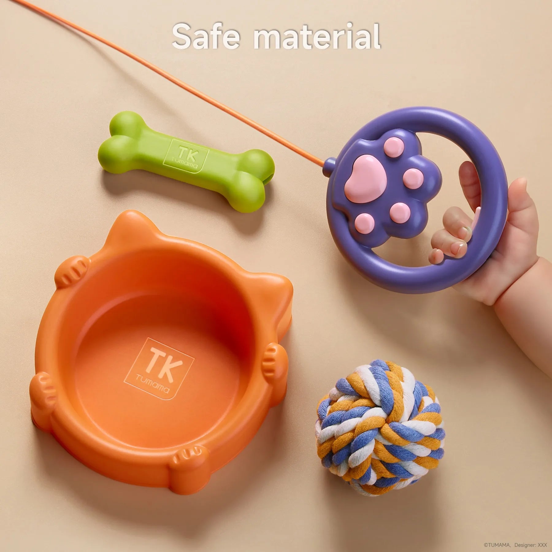 A set of accessories for a plush puppy toy, including an orange food bowl, green toy bone, colorful rope ball, and a purple paw-shaped remote leash, held by a child’s hand. All items are made from safe materials for kids.