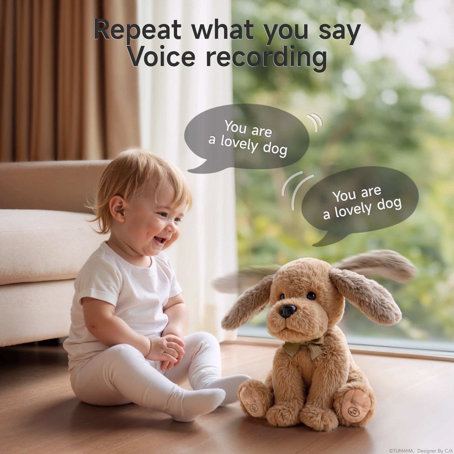 A happy toddler sits on the floor in front of a large window, smiling at a brown interactive plush puppy toy. The toy is facing the child, and both have speech bubbles that say 
