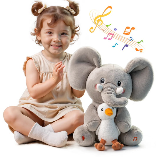 Smiling toddler girl sitting beside a gray elephant stuffed animal holding a duck plush, with colorful musical notes, showing the toy's interactive singing and voice recording features.