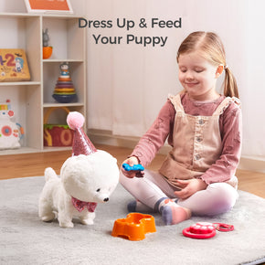 A young girl sitting on a rug, playing with a plush puppy dressed in a sparkly pink party hat and bowtie. She is holding a toy bone and 